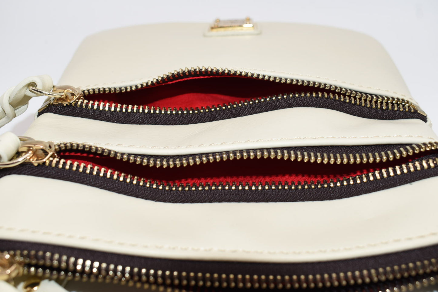 Dooney & Bourke Triple Zip Crossbody Bag in Cream